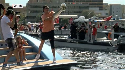 abc/tom brady tosses lombardi trophy to cameron brate in another boat during super bowl boat parade